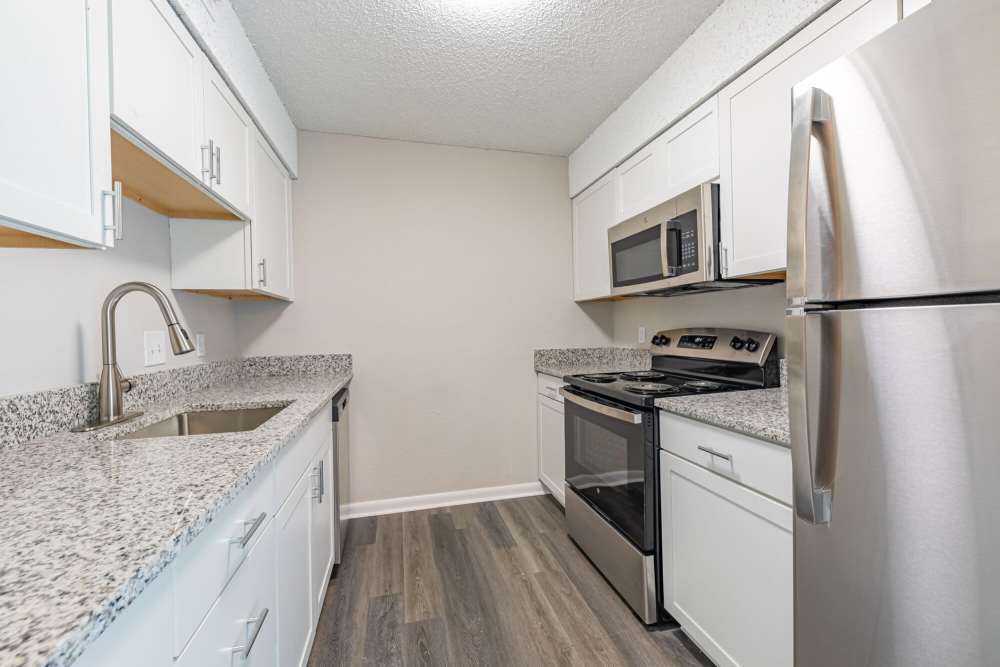 Upgraded kitchen with stainless steel appliances at Huffman Mill Townhomes in Burlington, North Carolina,