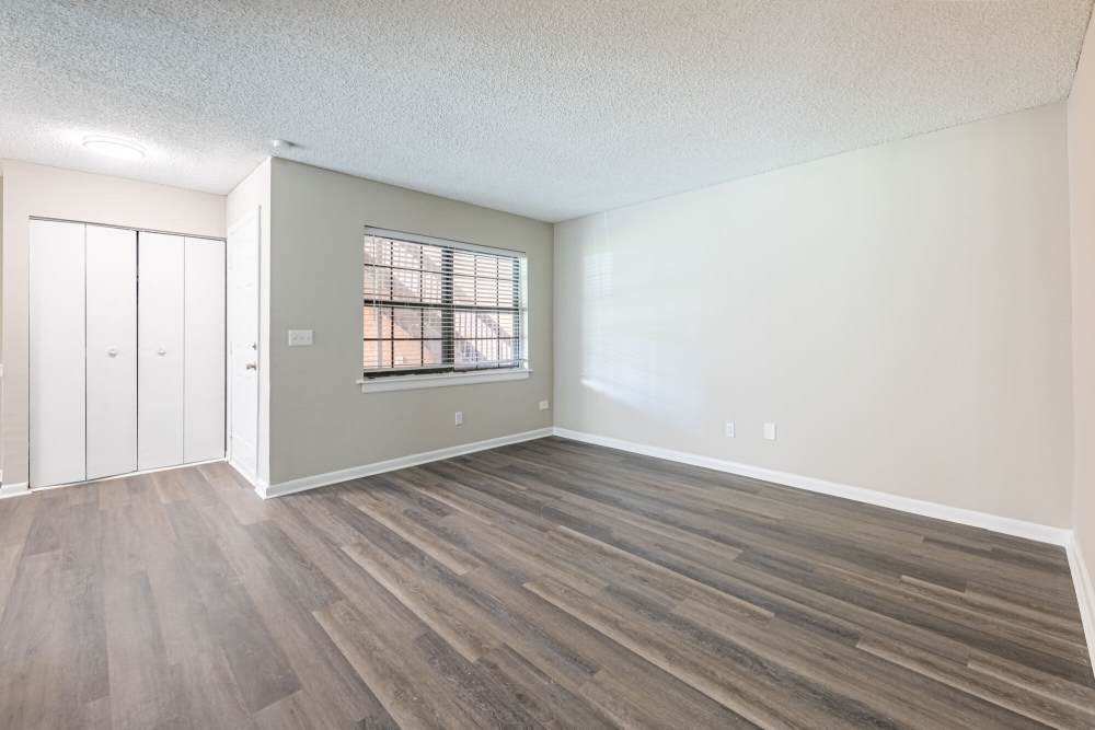 SPacious living room with wood-style flooring at Huffman Mill Townhomes in Burlington, North Carolina,