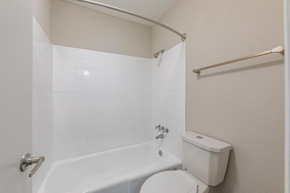 Bright bathroom with shower and tub at Huffman Mill Townhomes in Burlington, North Carolina,