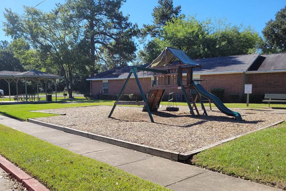 Outdoor playground at Southwood Apartments in Shepherd, Texas