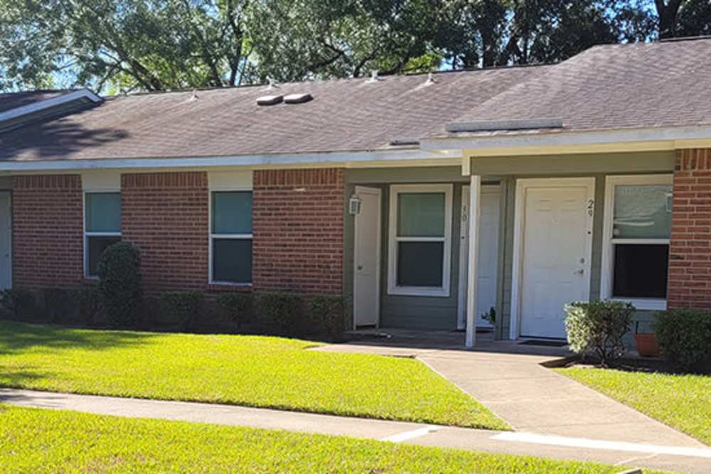 Apartments surrounded by lush greenery at Southwood Apartments in Shepherd, Texas