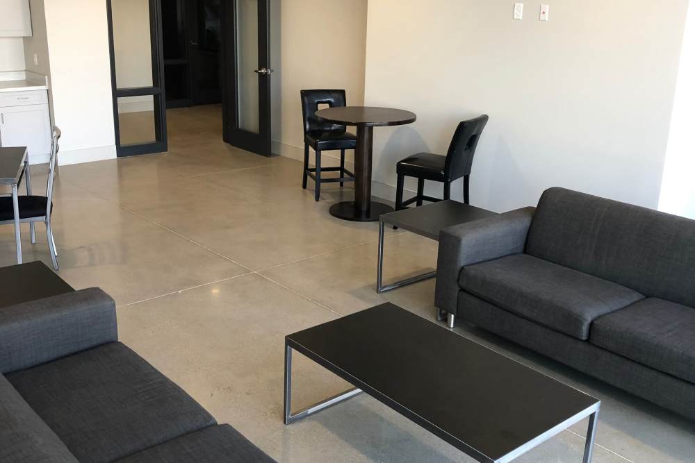 Spacious living room with couch and chairs at Leo and Alpine in Grand Rapids, Michigan