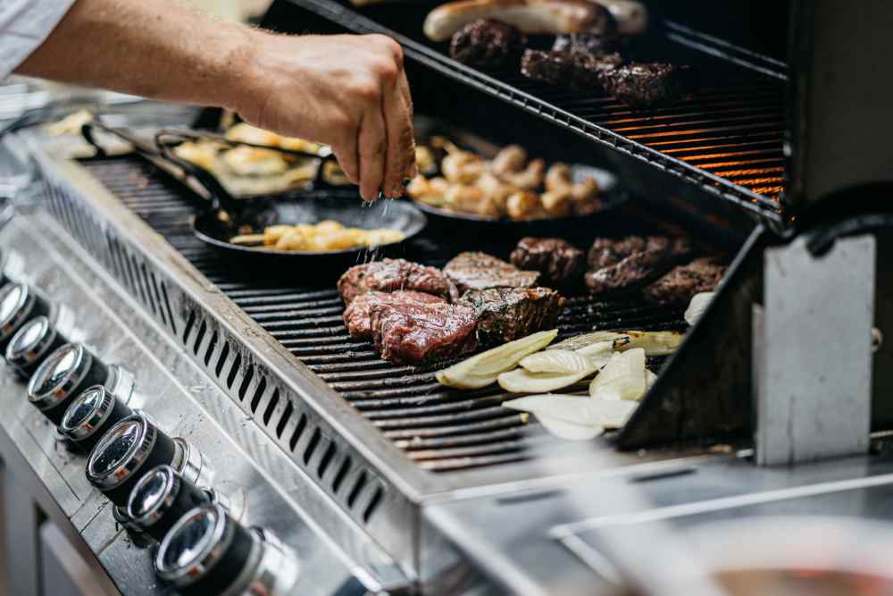 Community outside grilling station at The Cascalote in Glendale, Arizona