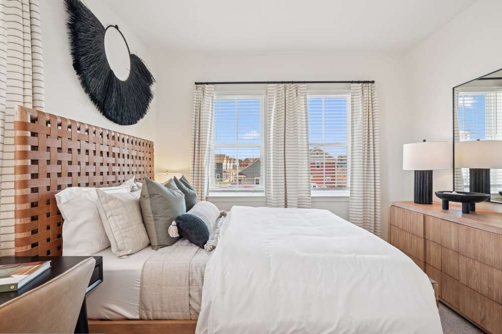 Bedroom with large windows at Hamlet Falling Creek in Midlothian, Virginia