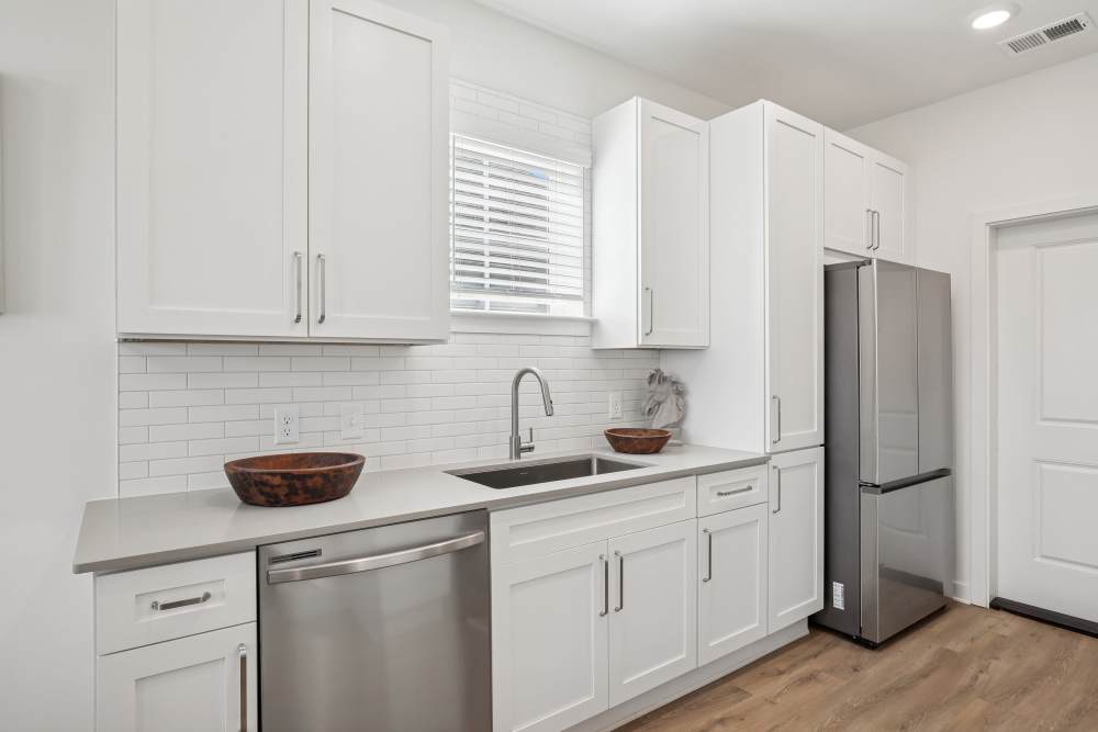 Kitchen with white cabinets at Hamlet Falling Creek in Midlothian, Virginia