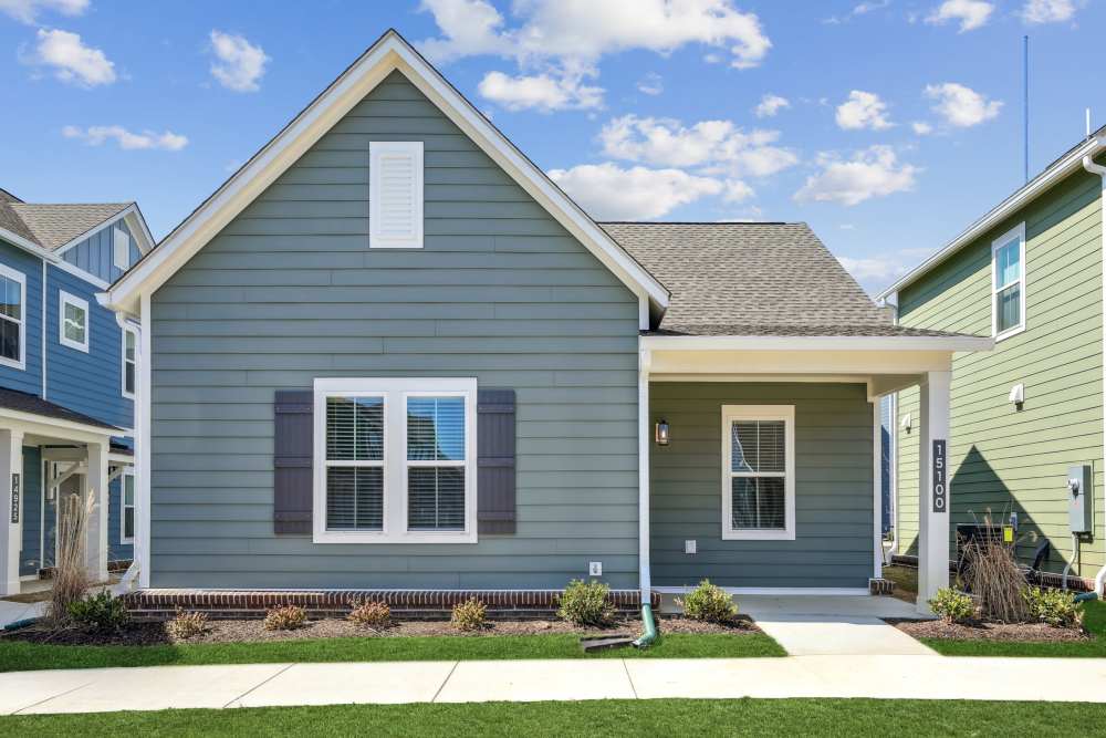Exterior view of blue home at Hamlet Falling Creek in Midlothian, Virginia