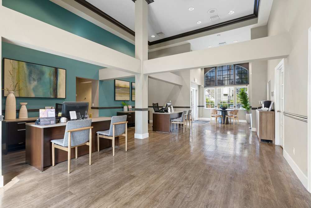 Welcoming lobby area with reception desks and stylish decor at Sofi Laguna Hills in Laguna Hills, California