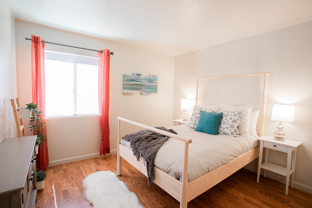 View of bright bedroom at Walnut Apartments in Santa Rosa, California