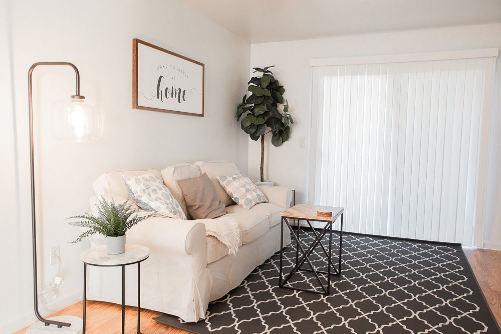 View of living room with couch at Walnut Apartments in Santa Rosa, California