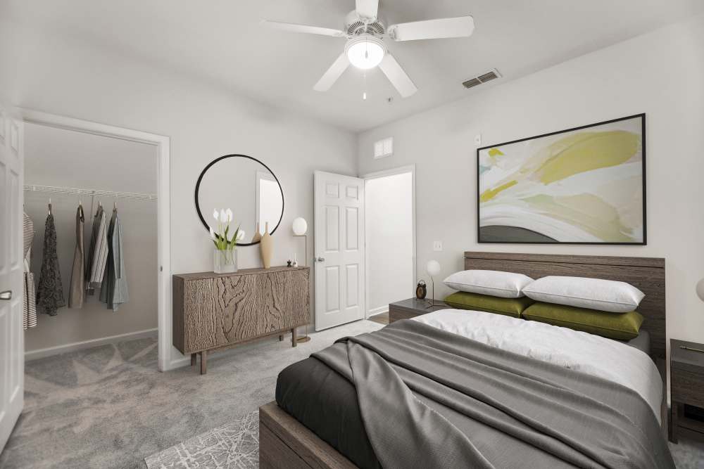 Bedroom with a walk-in closet at The Haven At West Melbourne in West Melbourne, Florida