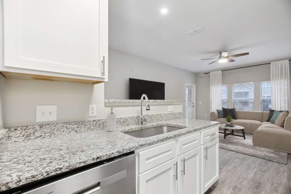 Kitchen with granite countertops at The Haven At West Melbourne in West Melbourne, Florida