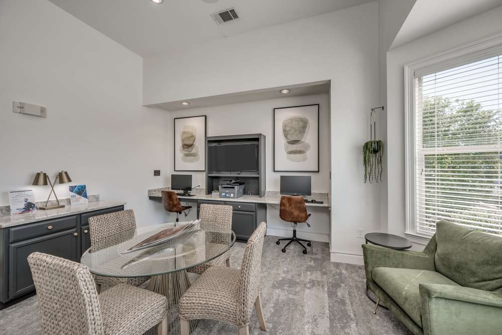 Clubhouse with sofa at The Abbey at Park Lakes in Humble, Texas