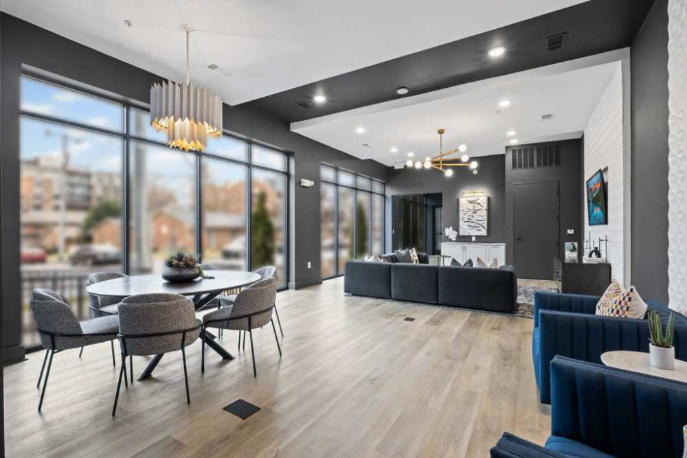 Living room and dining area of new apartments at Duet, Nashville, Tennessee showcasing modern design.