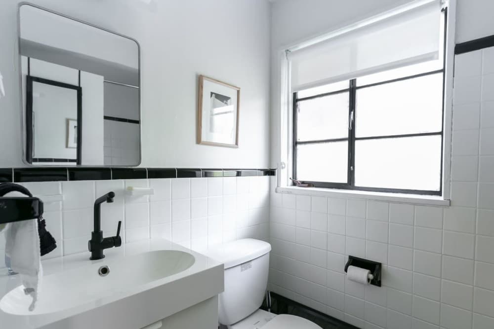 Bathroom with waterfall faucet sink at Detroit Living in Detroit, Michigan