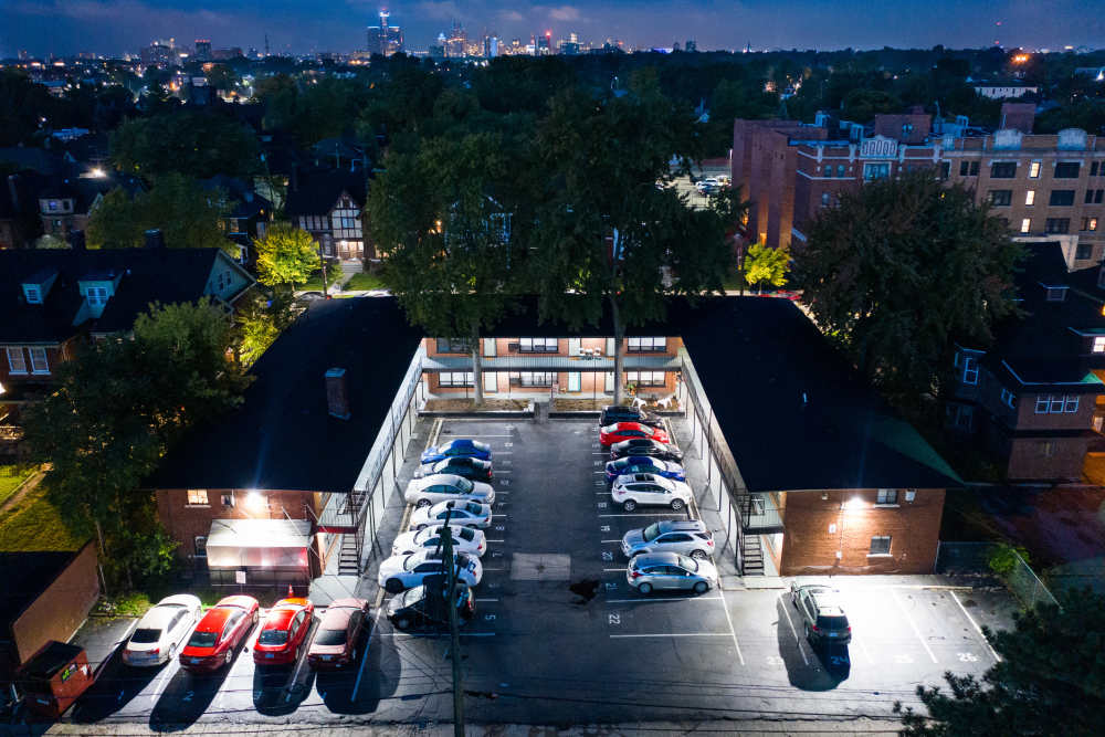 Aerial view housing community at night at Detroit Living in Detroit, 