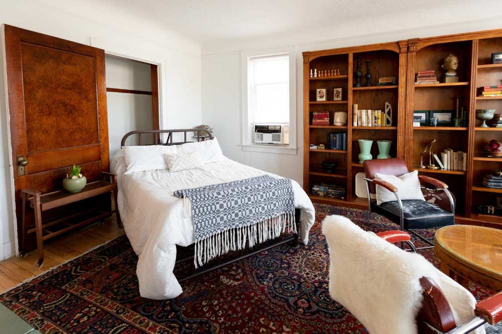 Bedroom with hard-wood style flooring at Detroit Living in Detroit, Michigan