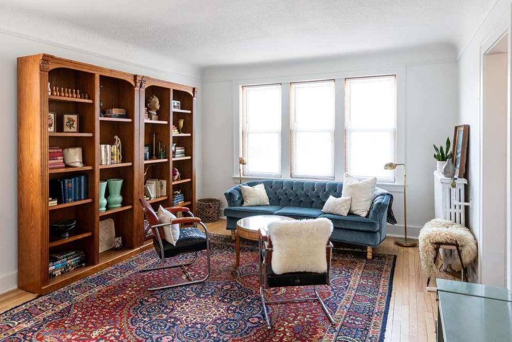 Open layout living room with hard-wood style flooring at Detroit Living in Detroit, Michigan