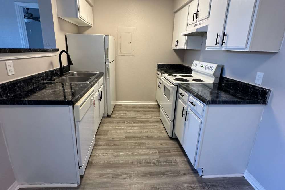 Kitchen with wooden cabinets at Garrett's Landing in Lawton, Oklahoma