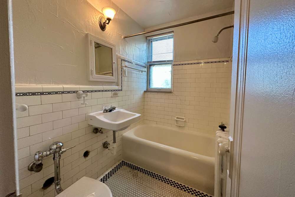 Bathroom with bathtub at Detroit Living in Detroit, Michigan
