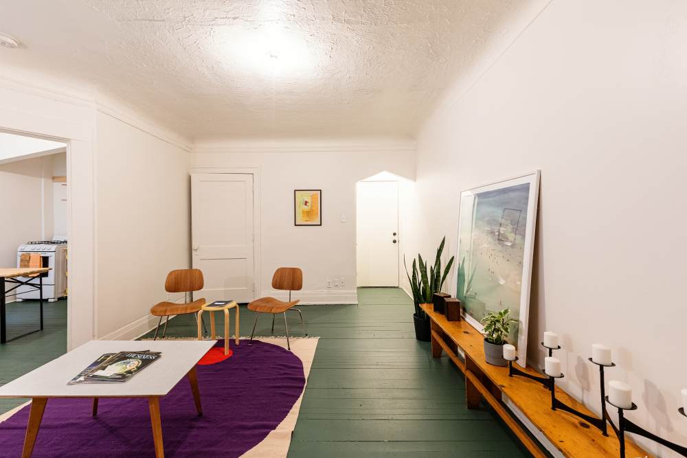 Living room with a designer rug at Detroit Living in Detroit,Michigan