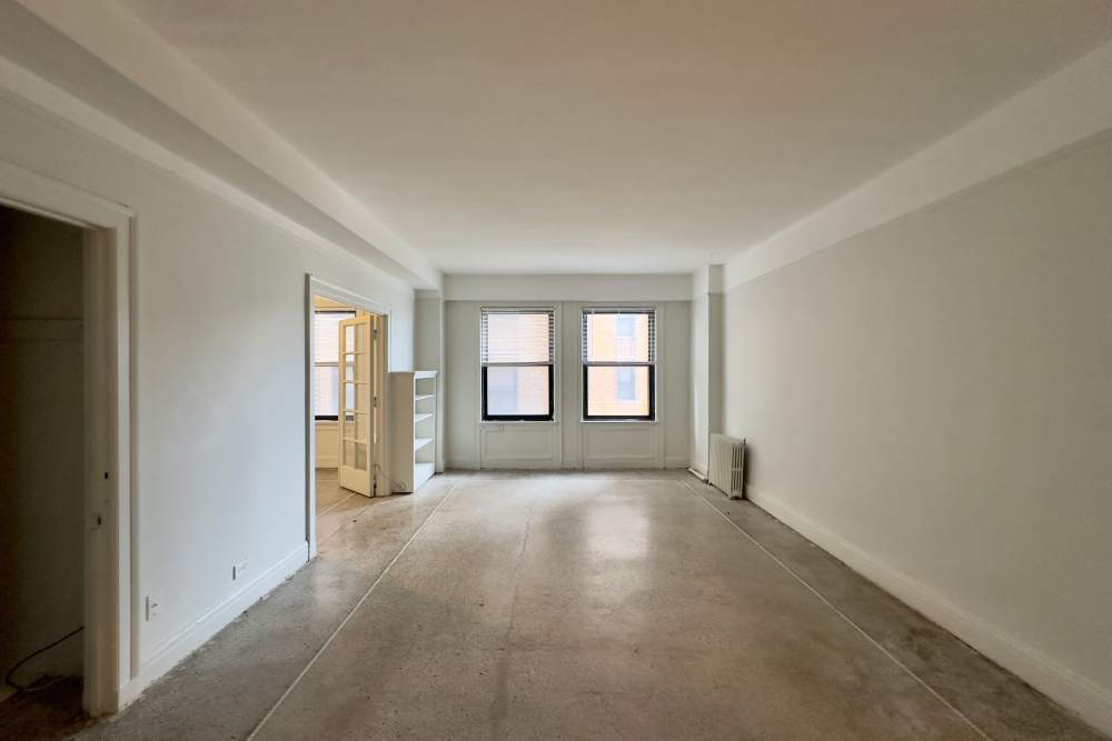 Spacious living room with two windows at Detroit Living in Detroit,Michigan