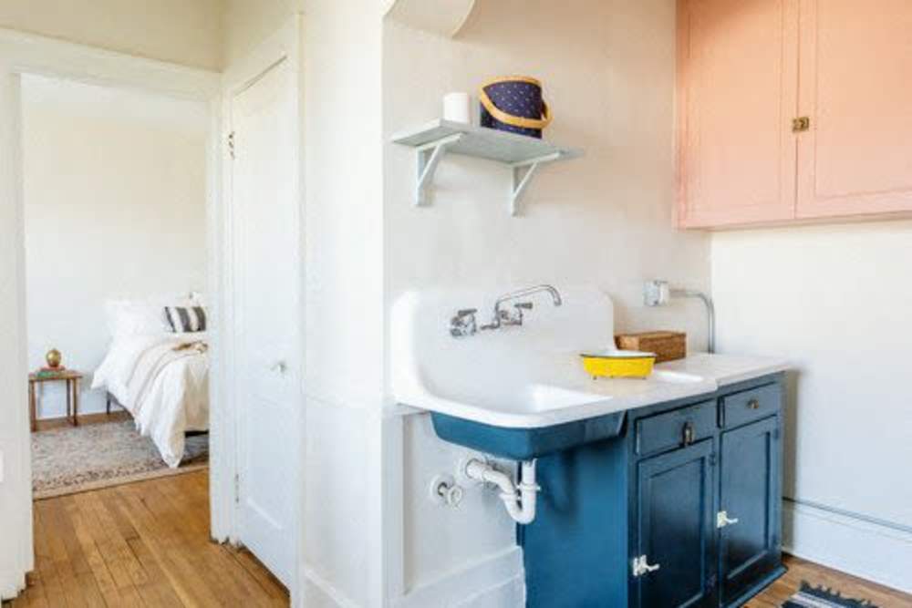 Kitchen with a refrigerator and a sink at Detroit Living in Detroit,Michigan