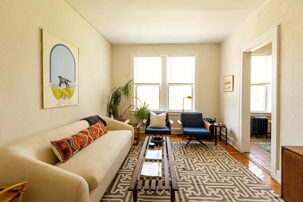 Spacious living room with carpet flooring at Detroit Living in Detroit,Michigan