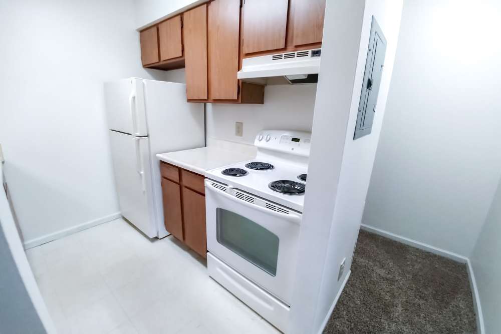 Kitchen with cabinets at Mill Pond (Brooklyn) in Brooklyn, Michigan