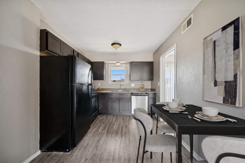 Dining area near kitchen and appliances at Vintage At 50th in Oklahoma City, Oklahoma