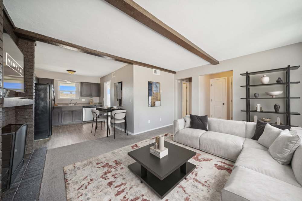 Living room area showcasing the kitchen and dining area at Vintage At 50th in Oklahoma City, Oklahoma