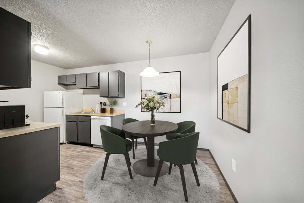 Dining area with kitchen at Sherwood Pointe Apartments in Shawnee, Oklahoma