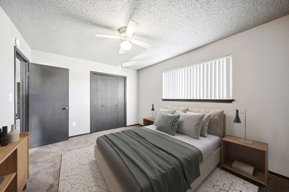 Different angle of cozy bedroom showcasing the closet at Sherwood Pointe Apartments in Shawnee, Oklahoma