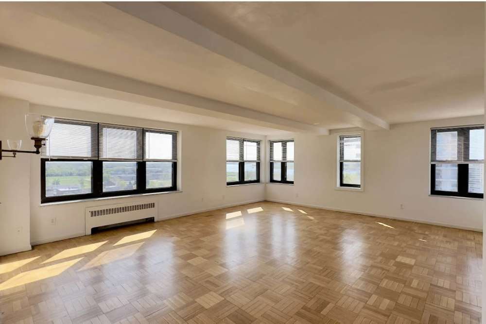 Unfurnished apartment room with wood-style flooring at Detroit Living in Detroit,Michigan