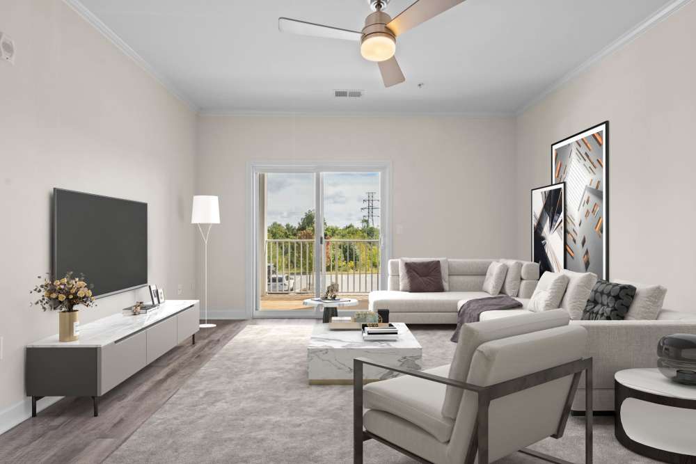Spacious living room with access to patio through glassdoor at Hawks Landing in Hickory, North Carolina,