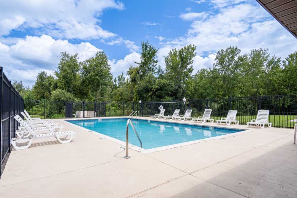 Pool with surrounded greenery at Fox Hollow in Orlando, Florida