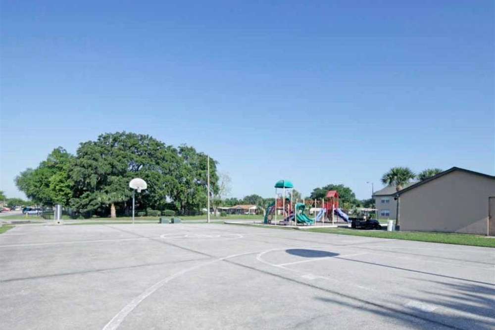 Basketball court with view to playground at Fox Hollow in Orlando, Florida