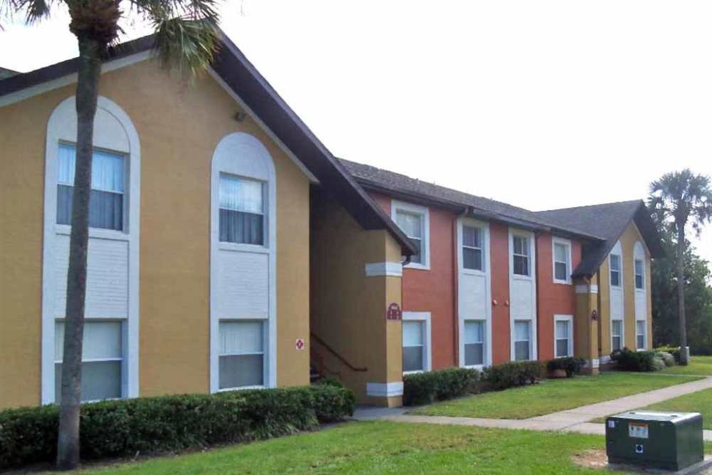 Community exterior view with sidewalk at Fox Hollow in Orlando, Florida