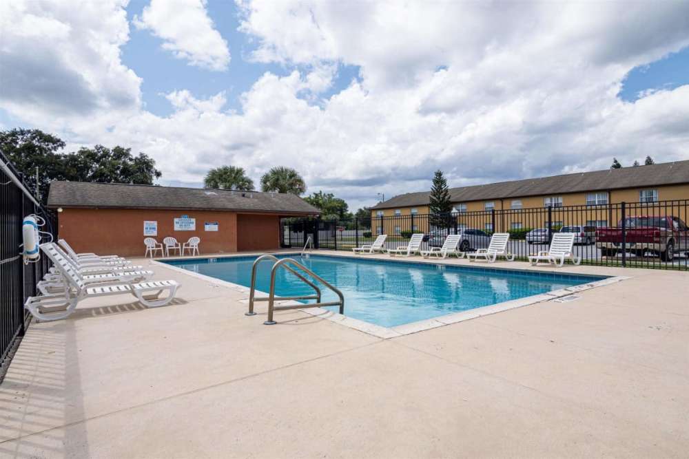 Pool with lounge chair at Fox Hollow in Orlando, Florida