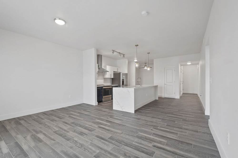 Unfurnished apartment room with wood-style flooring at The Lofts At West 7th in Fort Worth,Texas