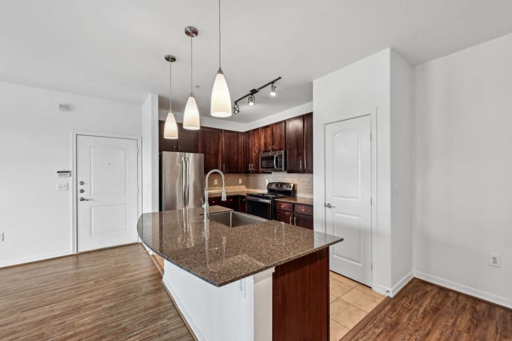 Kitchen with breakfast counter at Barron Park in Pearland, Texas