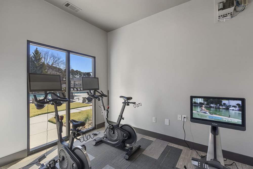 Fitness center with cycling equipment at Chandler At University Tower in Durham, North Carolina
