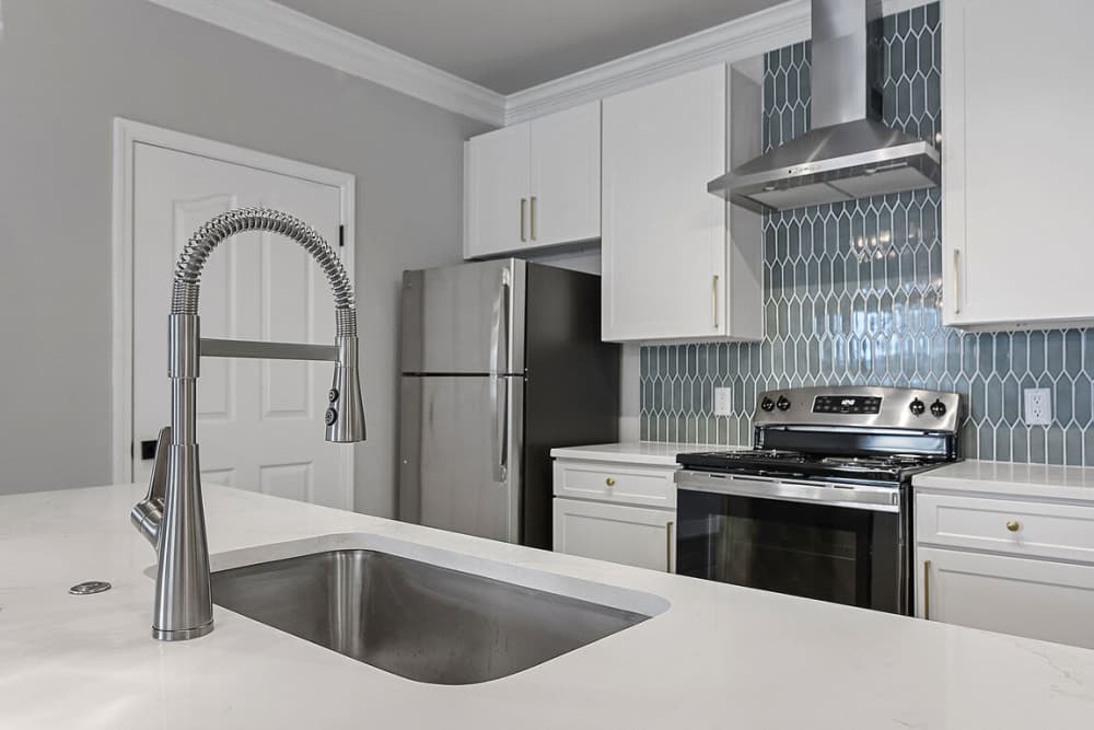 View of kitchen with fridge at Seagrove in Conroe, Texas