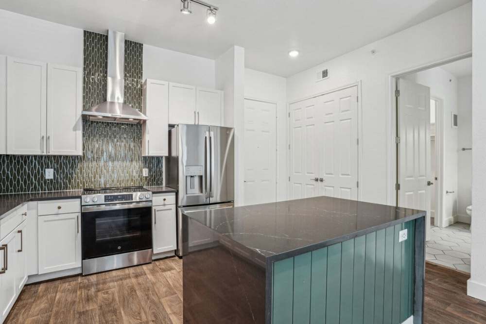 Apartment kitchen with energy-efficient appliances at Dorian and Encore in Plano, Texas