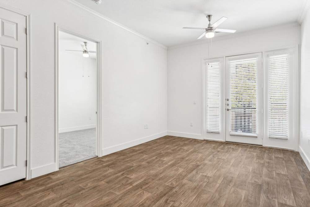 Apartment bedroom with ceiling fan at Dorian and Encore in Plano, Texas