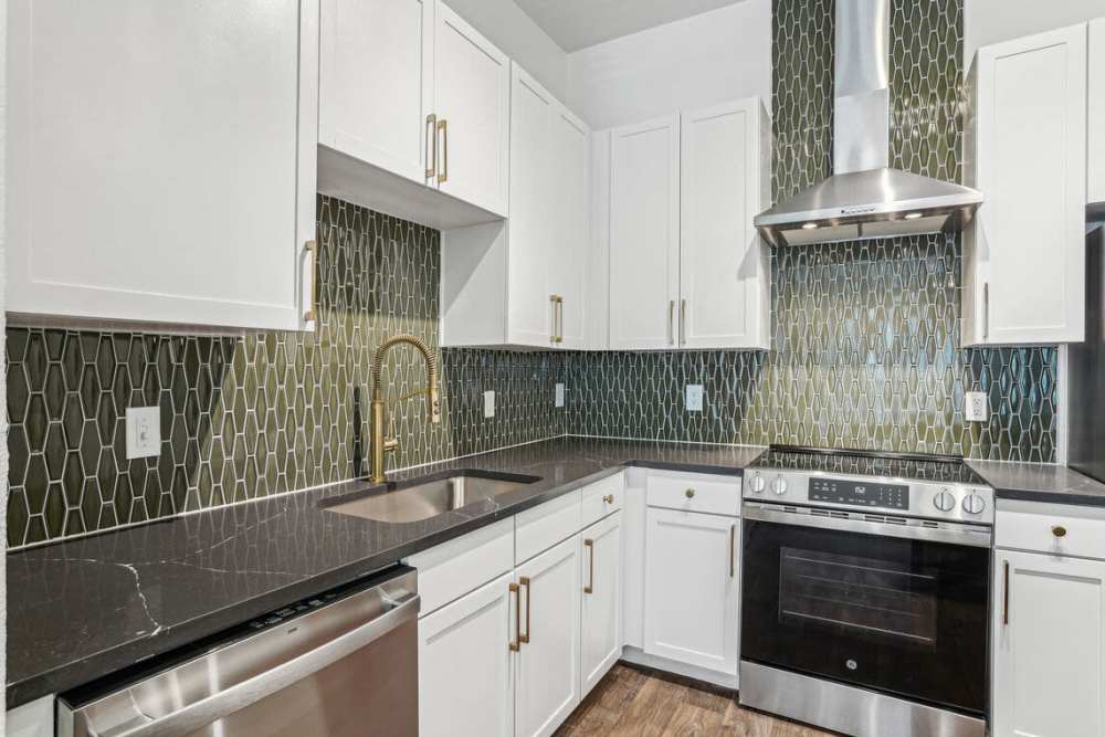 White cabinetry and stainless-steel appliances at Dorian and Encore in Plano, Texas