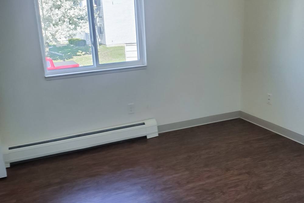 Bedroom space at Mapleview Apartments in Maple Rapids,