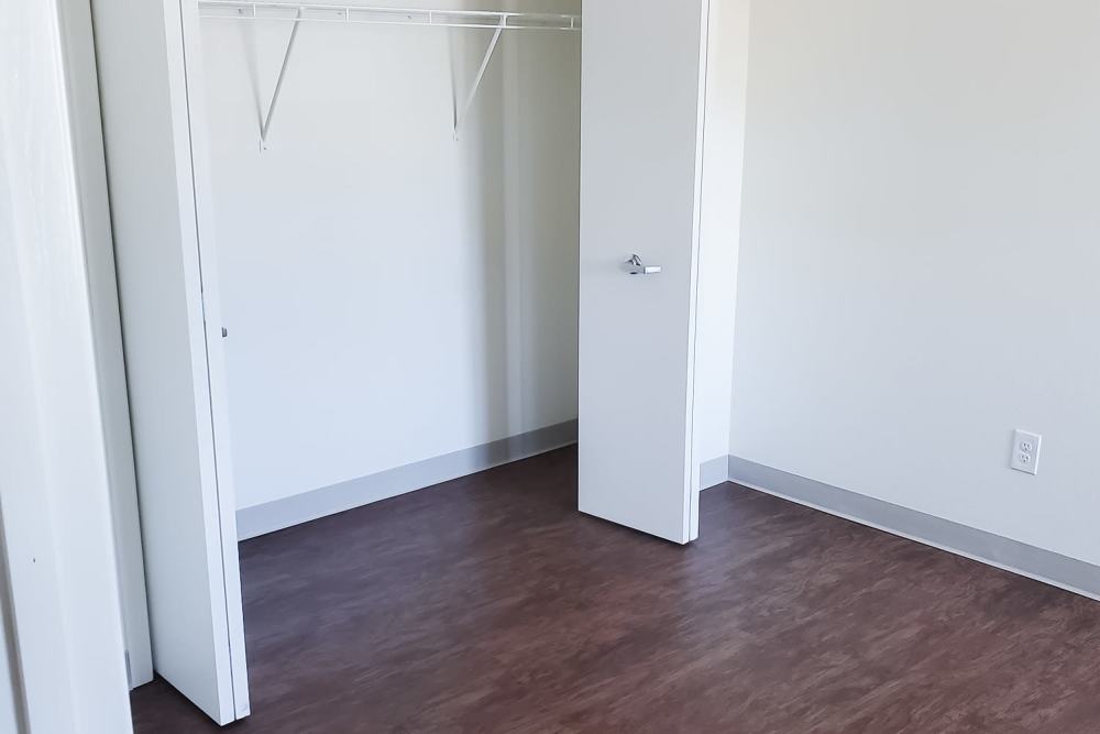 Closet in bedroom at Mapleview Apartments in Maple Rapids,