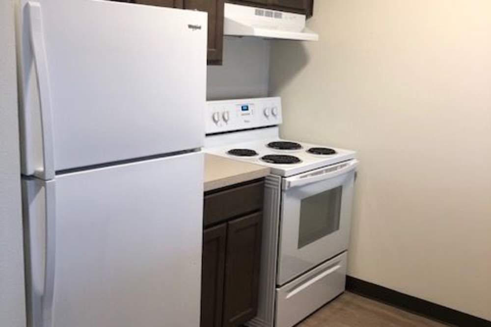 Kitchen with white appliances at Franklin Pointe in Reed City,