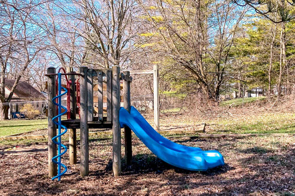 Playground with a slide at Manchester Apartments in Manchester, Michigan
