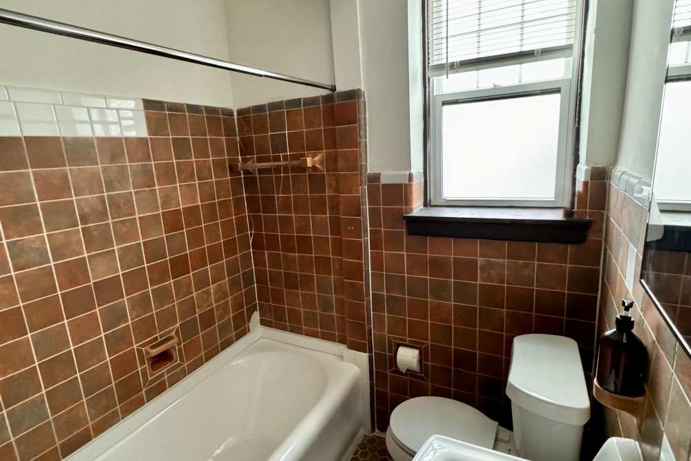 Fully bathroom with bathtub at Detroit Living in Detroit, Michigan